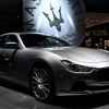 A silver 2016 Maserati Ghibli is shown parked at an auto show in right front angled view