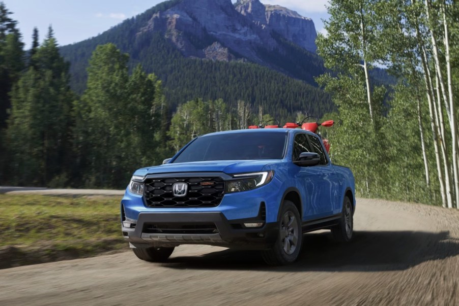 The 2024 Honda Ridgeline driving on a dirt road