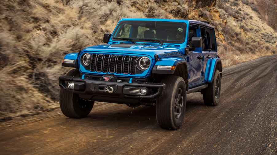 The 2024 Jeep Wrangler on a muddy road