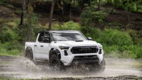 The 2024 Toyota Tacoma TRD Pro splashing through mud