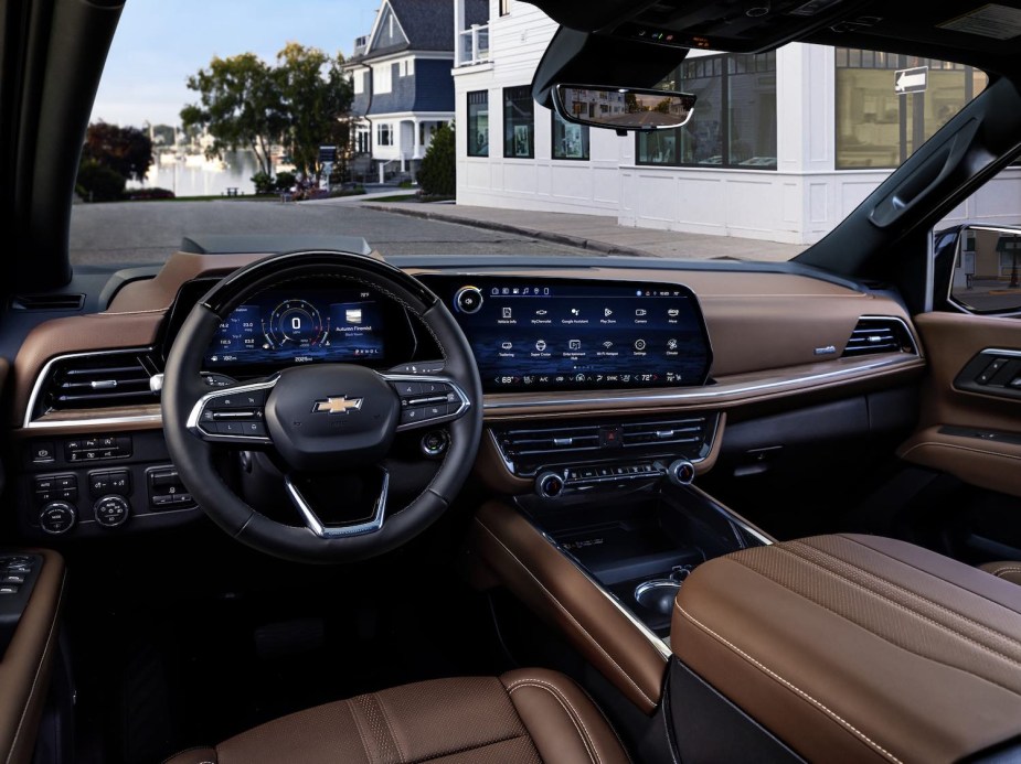 The brown leather interior of the 2025 Chevrolet Suburban SUV.