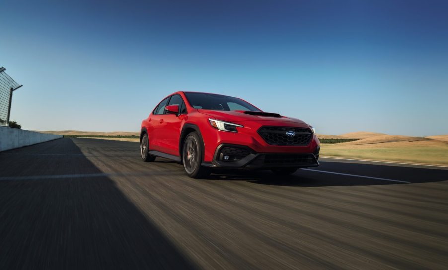 A 2024 Subaru WRX TR speeds around a track.