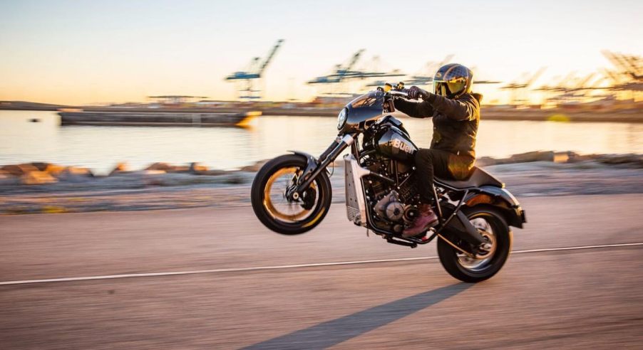 A Buell Super Cruiser performs a wheelie.