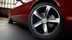 A 2014 Dodge Challenger muscle car shows off its wheels.