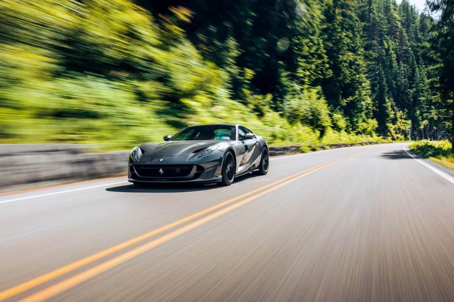 A gray Ferrari 812 Superfast, like Michael B. Jordan's, blasts down a road.