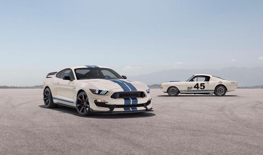 A Ford Mustang Shelby GT350 sits next to a classic GT 350.