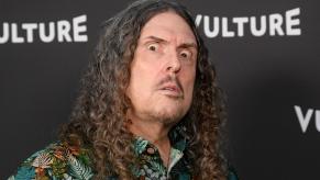 Weird Al Yankovic makes a face at a photo shoot.