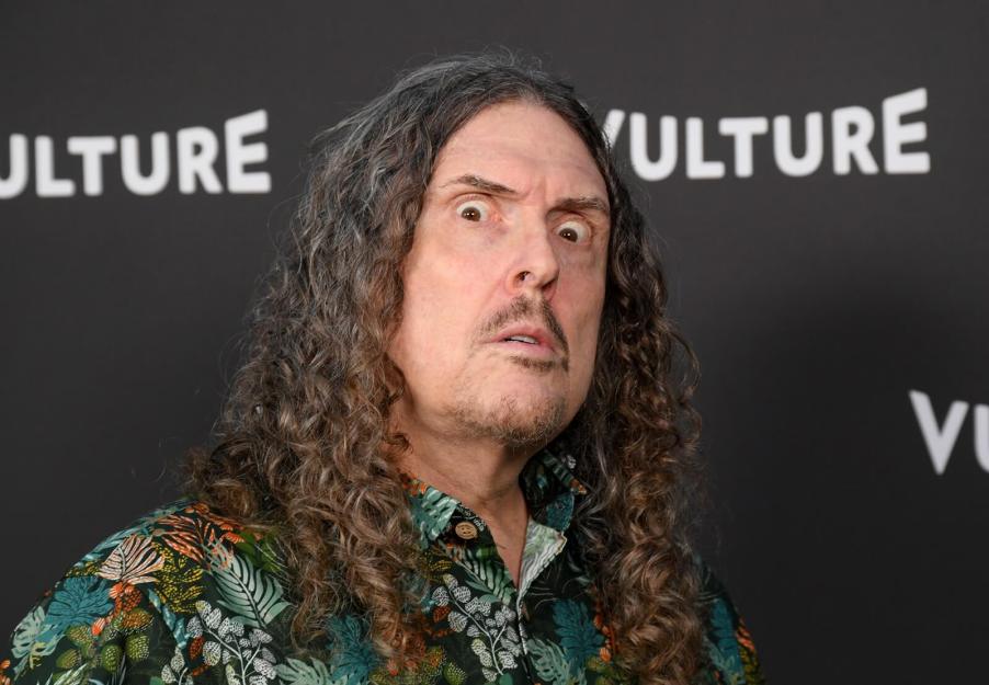 Weird Al Yankovic makes a face at a photo shoot.