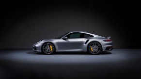 A silver Porsche 911 Turbo S shows off its side profile.