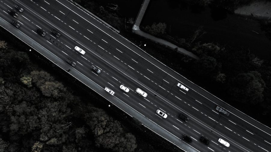 Overhead view of a highway full of cars.