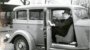 Race car driver piloting 1933 DeSoto backward