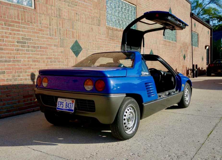 Autozam AZ-1 with its gull-wing door open.