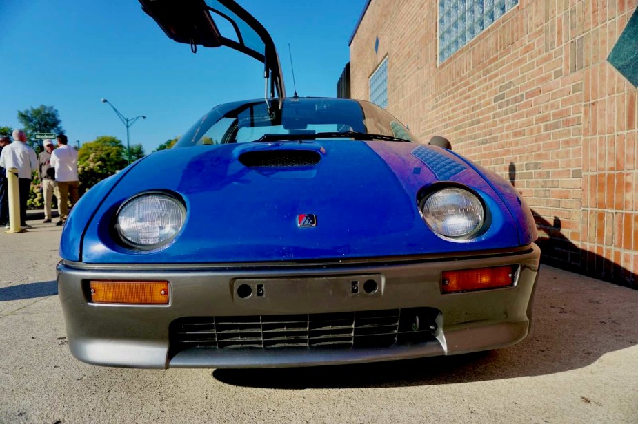 The headlights and hood of a Autozam AZ-1 Kei-class sports car.