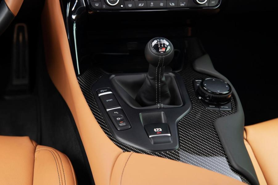 A 2023 Toyota GR Supra shows off its manual gear selector.