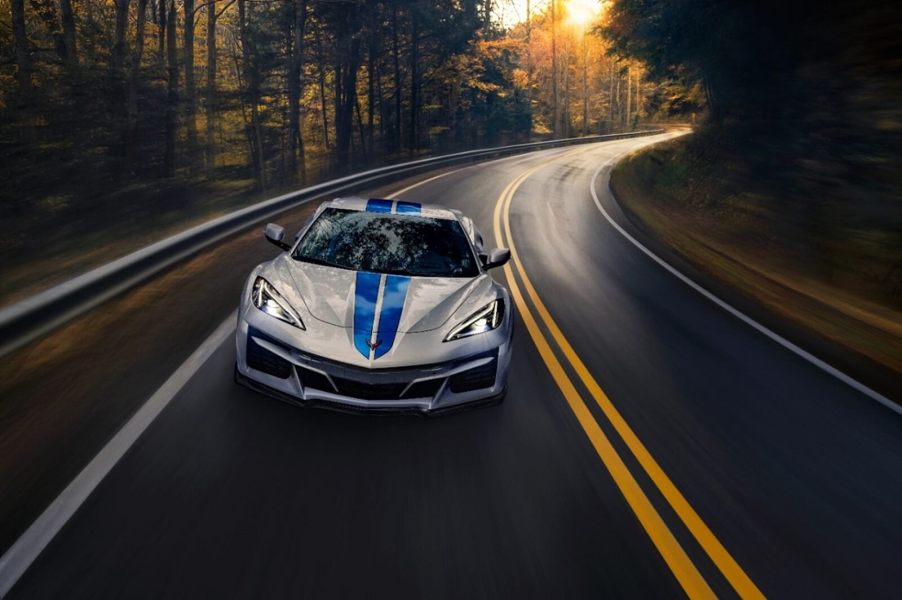 A 2024 Chevrolet Corvette E-Ray corners on a wet road.