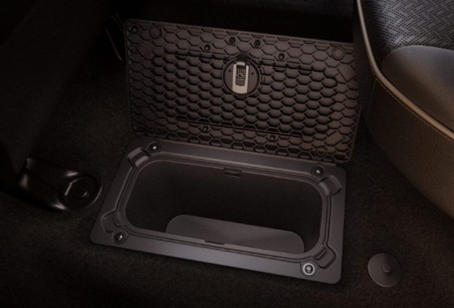 The underfloor storage compartment in a Ram 2500 heavy-duty pickup truck.