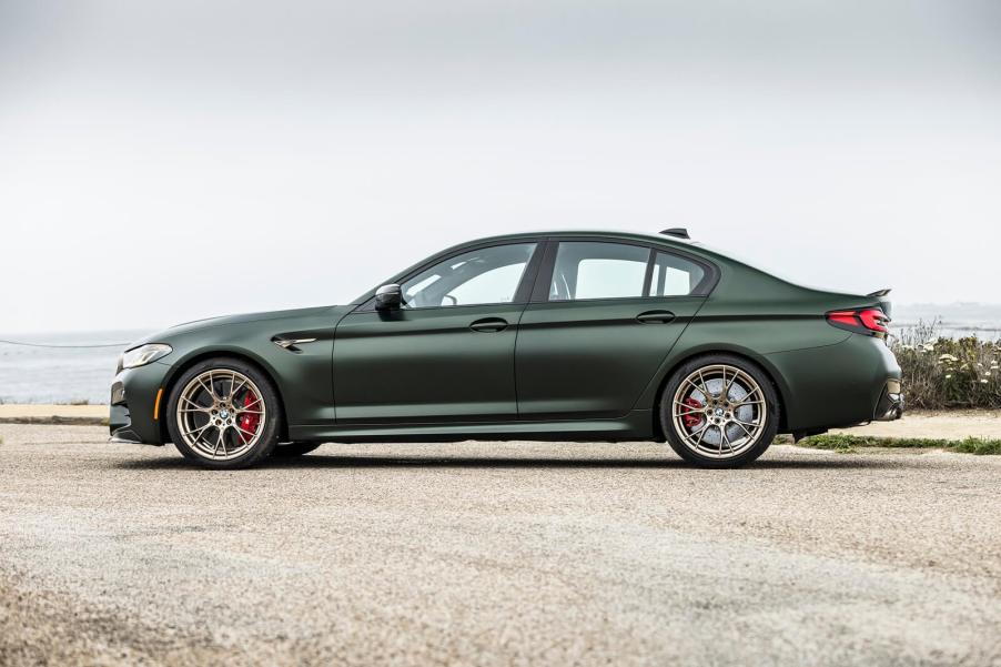 A green 2023 BMW M5 CS shows off its side profile.