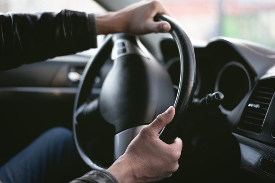 A car driver navigates through a donut skid.