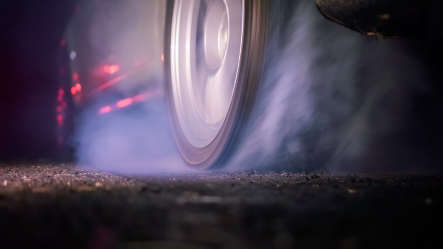 High horsepower car completing a burn out before a drag race.