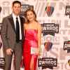 NASCAR Cup Series driver, Denny Hamlin and Jordan Fish pose for photos on the red carpet prior to the NASCAR Awards and Champion Celebration at the Music City Center on November 30, 2023 in Nashville, Tennessee.