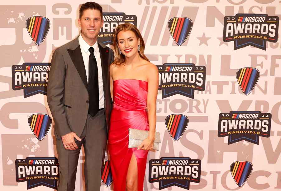 NASCAR Cup Series driver, Denny Hamlin and Jordan Fish pose for photos on the red carpet prior to the NASCAR Awards and Champion Celebration at the Music City Center on November 30, 2023 in Nashville, Tennessee.