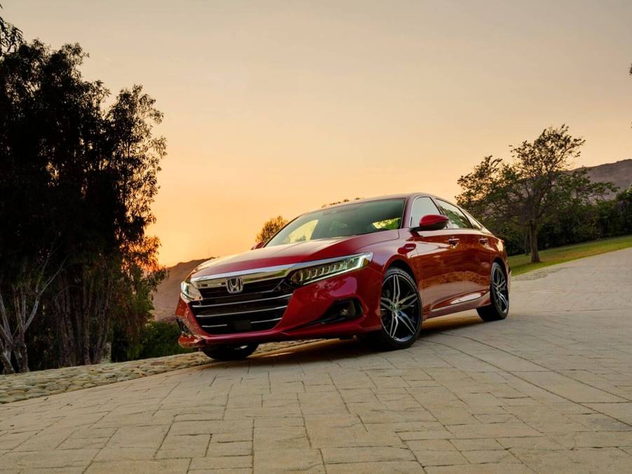 A red Honda Accord Touring Hybrid shows off its front-end styling.