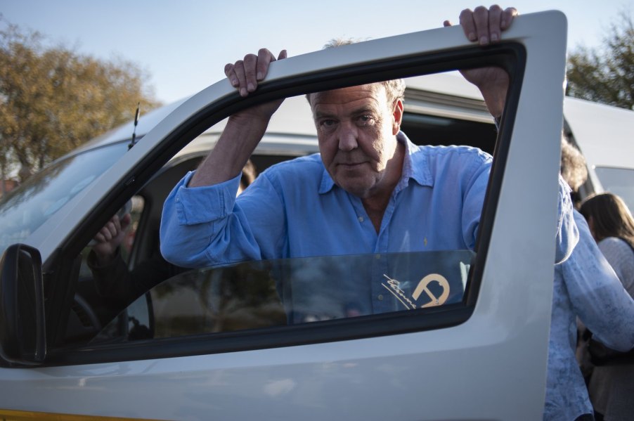 Top Gear and The Grand Tour host Jeremy Clarkson stands by a car door.