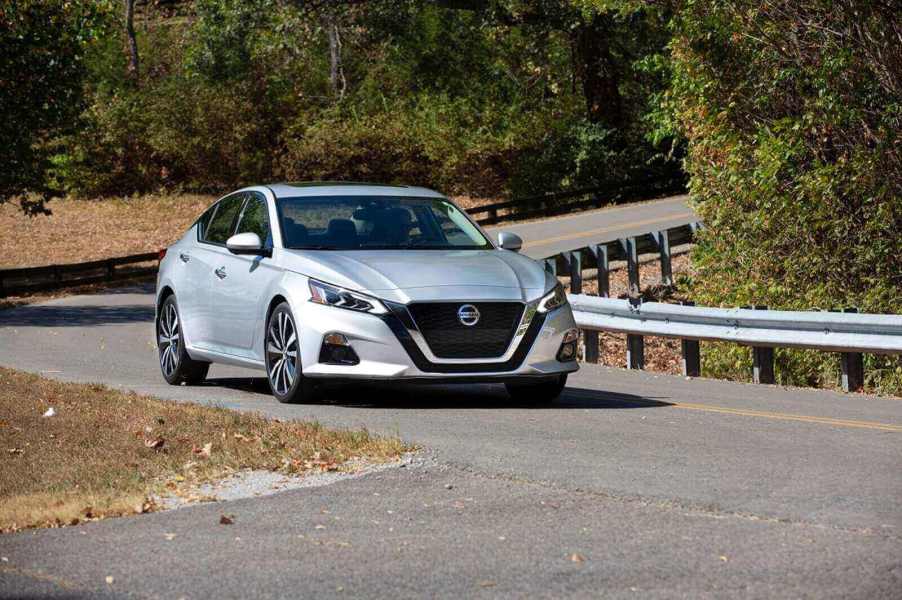 A silver Nissan Altima four-door sedan takes a corner.