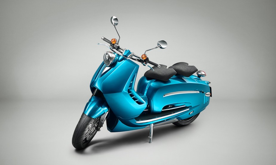 Teal retro scooter with modern KTM superbike engine.