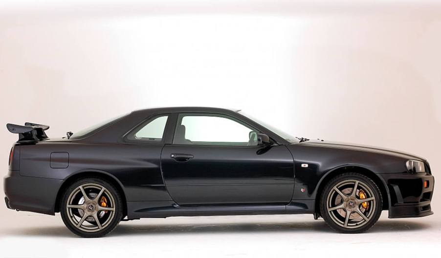 A 1999 Nissan Skyline GT-R shows off its profile.