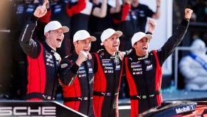 Dane Cameron, Felipe Nasr, Matt Campbell and Josef Newgarden of the No. 7 Penske Porsche celebrate In victory lane after winning overall in the Rolex 24 at Daytona