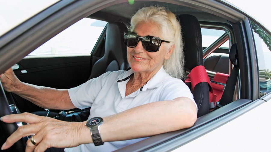 Sonja Margherita Heiniger sits in her Porsche 911 Turbo S race car.