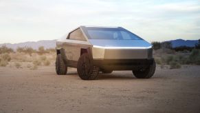 The Tesla Cybertruck parked in the sand