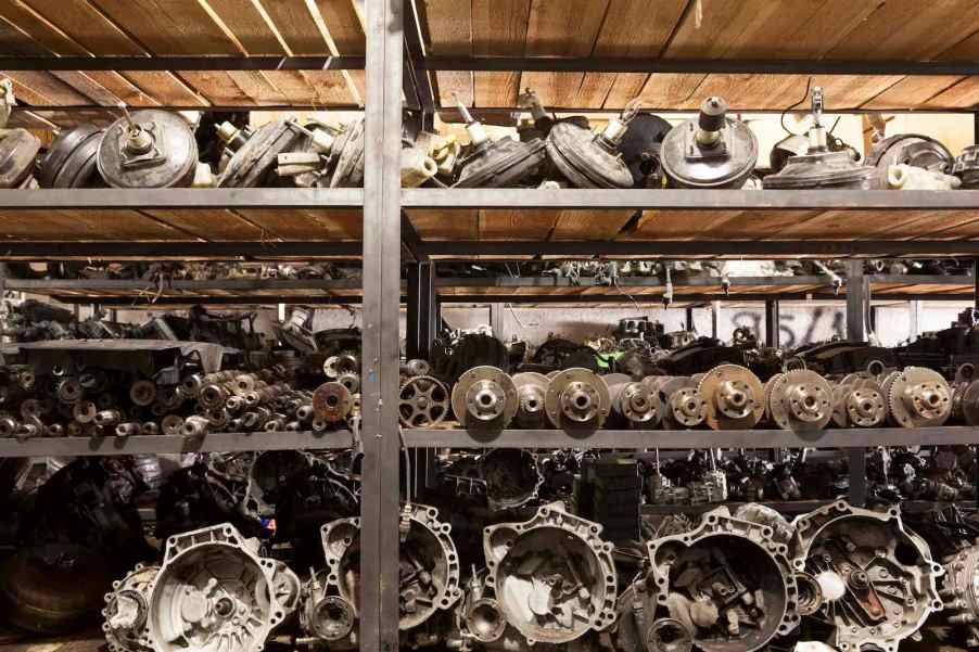 Row of scrap engines and transmissions from Ford F-150 Triton truck.