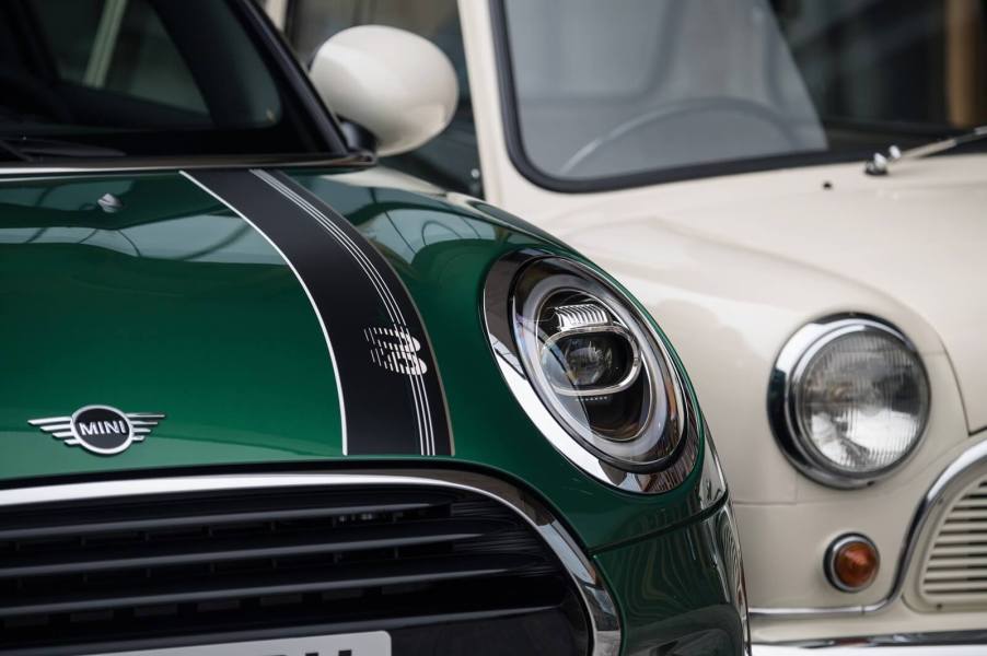 A new MINI Hardtop with a 1959 Morris Mini Minor.