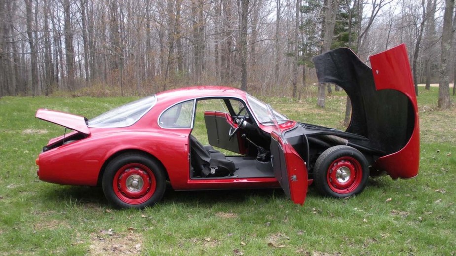 Red SSZ Stradale sports car with an open hood and trunk