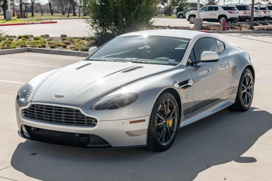 Silver Aston Martin coupe.