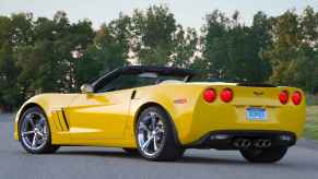 A yellow 2012 Chevrolet Corvette convertible is shown parked at left rear angle part of free fuel leak repair bulletin