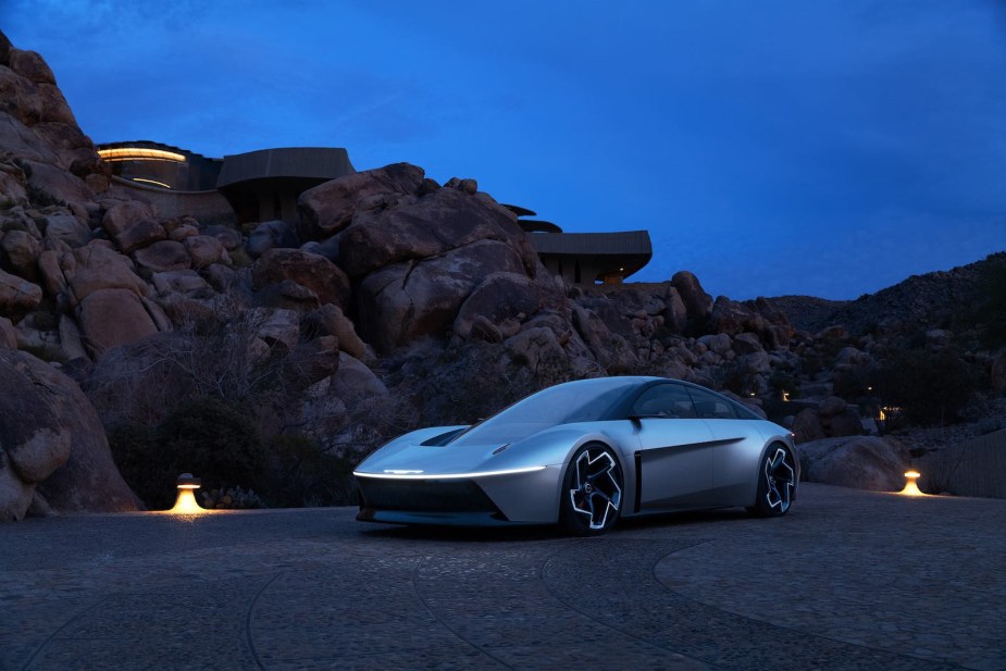 Chrysler Halcyon performance EV parked out doors at night.