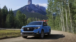 The 2024 Honda Ridgeline TrailSport on a dirt road