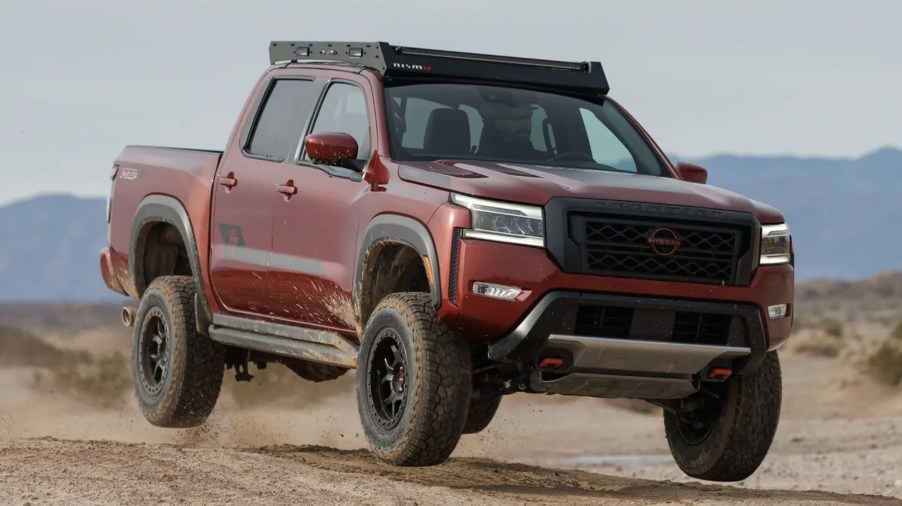 The 2024 Nissan Frontier Forsberg Edition jumping through mud