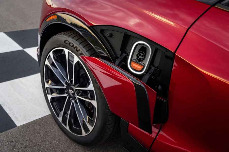 A red 2024 Chevrolet Blazer EV charging port located on left fender is shown in close view