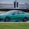 A 2024 Montreal Verde Alfa Romeo Giulia Quadrifoglio on a track