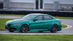 A 2024 Montreal Verde Alfa Romeo Giulia Quadrifoglio on a track