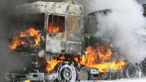 Semi truck burning on the highway