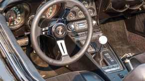 A C3 Corvette shows off its manual transmission.