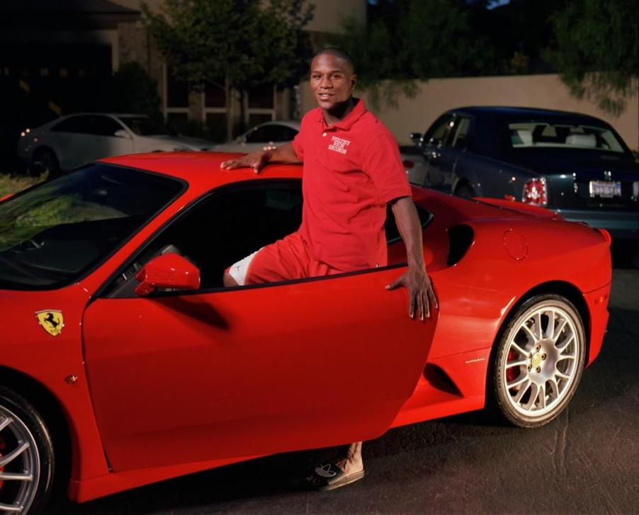 Floyd Mayweather Jr., who was blacklisted by Ferrari, poses with his Ferrari F430.