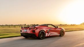 A red Chevrolet C8 Corvette Convertible with a Hennessey H700 package.