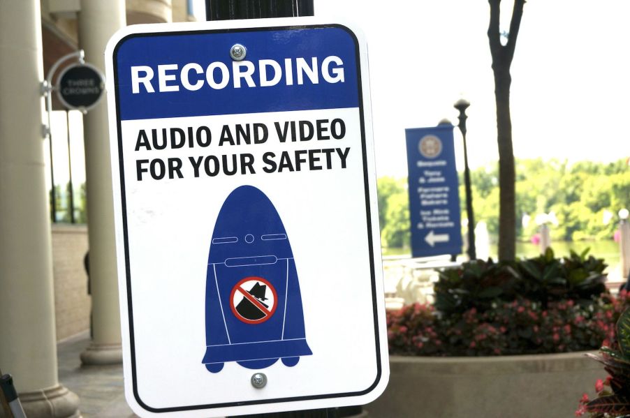 Sign warning the public a police sentry patrol robot is recording video.