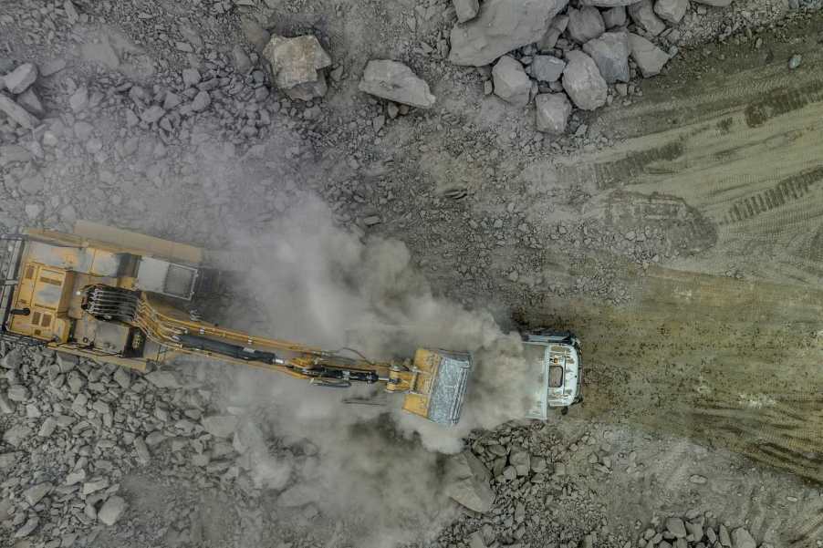 Excavator digs lithium at a mine in brazil.